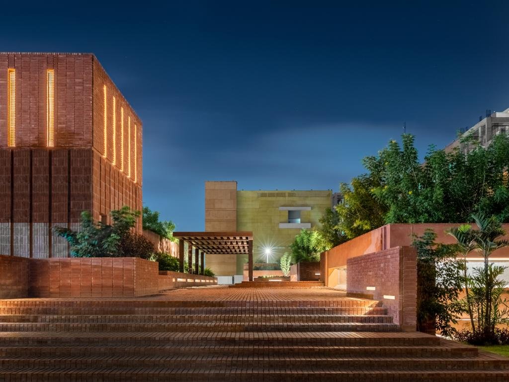 Entry from the outside to the landscape is from a cascading staircase that leads up to a raised plinth, while a stair-tower connects to the basements below.