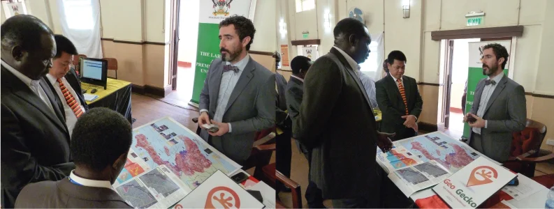 Geo Gecko displaying some of the previous work of Geo Gecko staff to the Ugandan Minister for Disaster Preparedness, the Dean of the Makarere School of Public Health, the Principal Innovations Director, Makarere and the Disaster Risk Management Advisor to the UN Development Programme/Office of the Prime Minister.