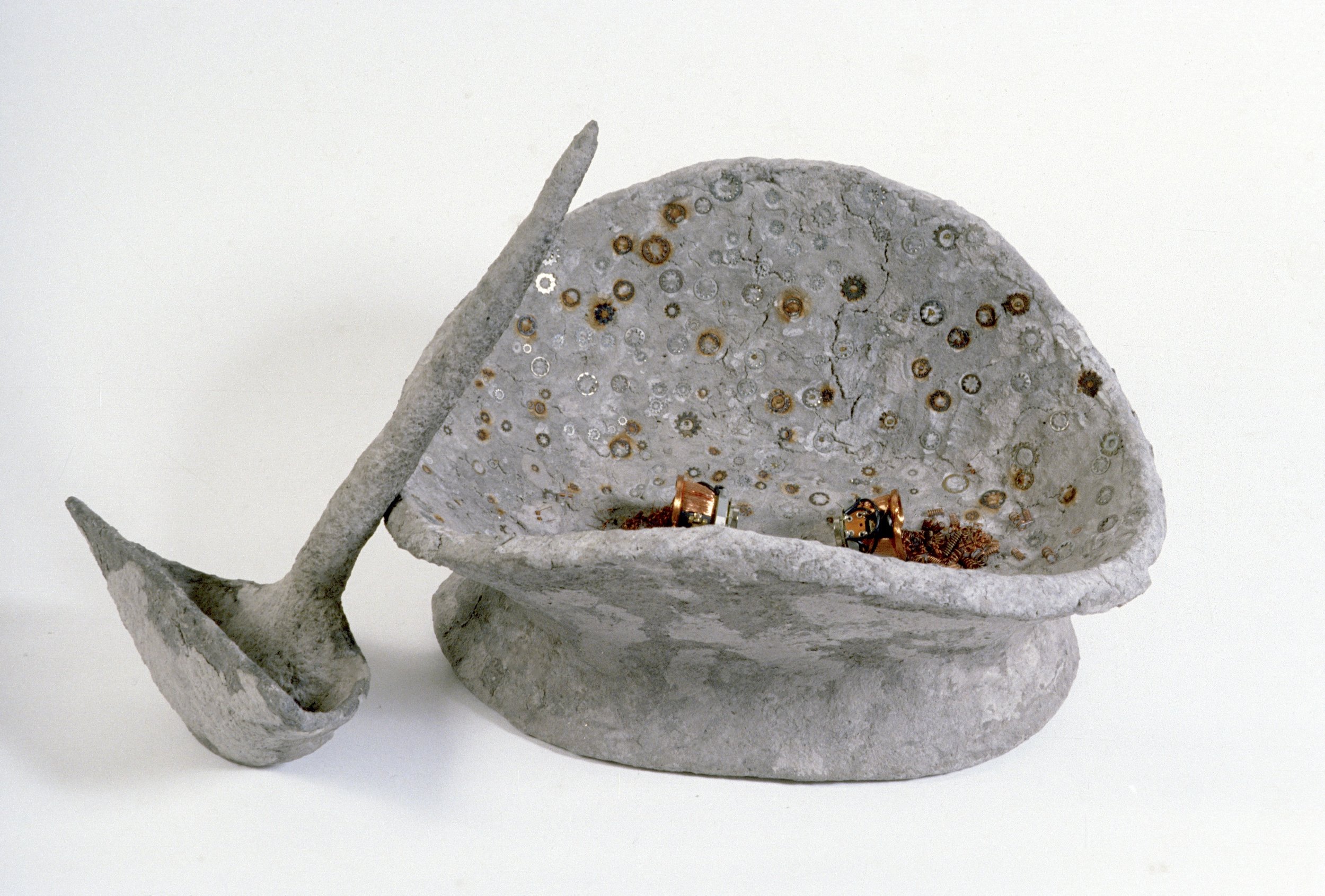 Container With Ladle materials include; armature with paper mache, hardware bits. 20 x 30 inches 1986