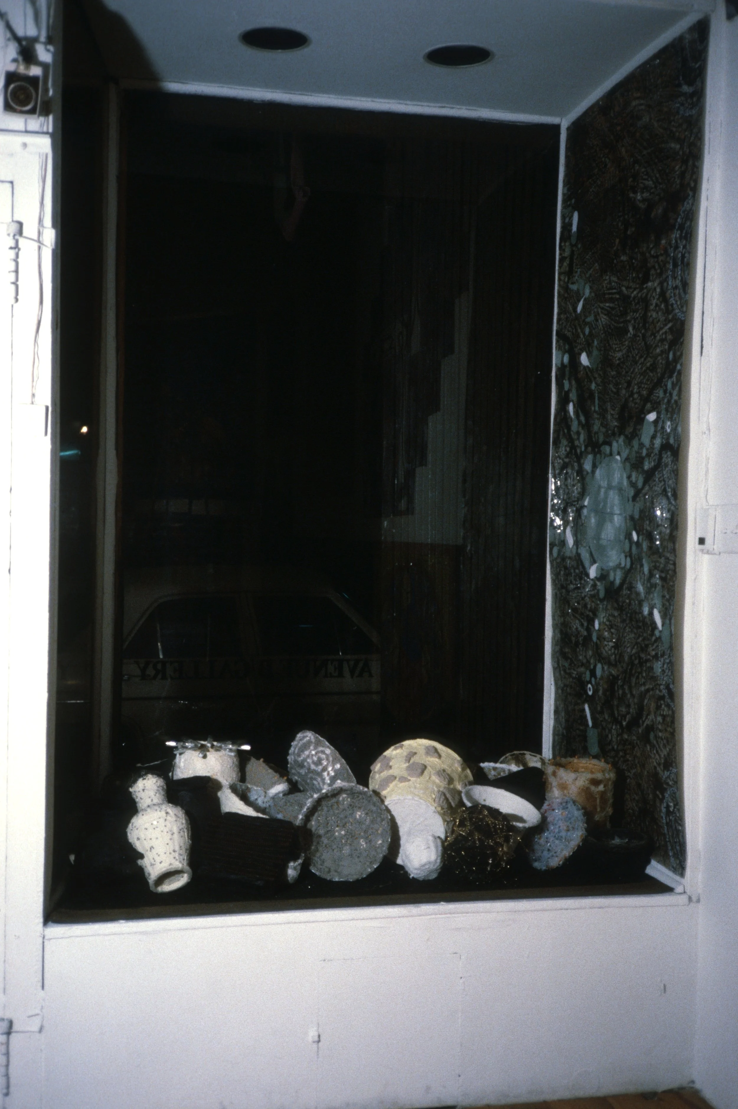 Window Installation at Avenue B Gallery, 1987 acrylic paint, mica, found objects, silicone, paper, caulk, glass