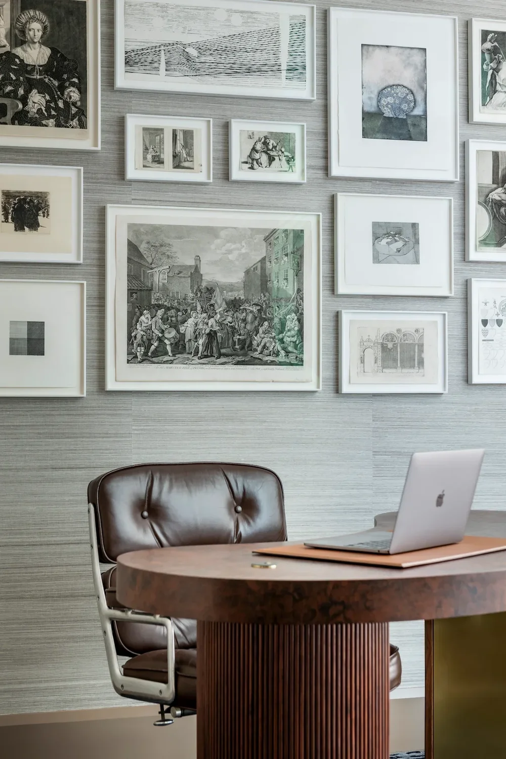 Framed artwork displayed beside art books