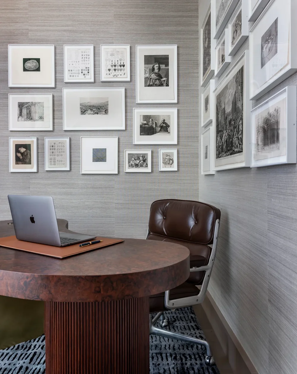 Office with a framed art collection