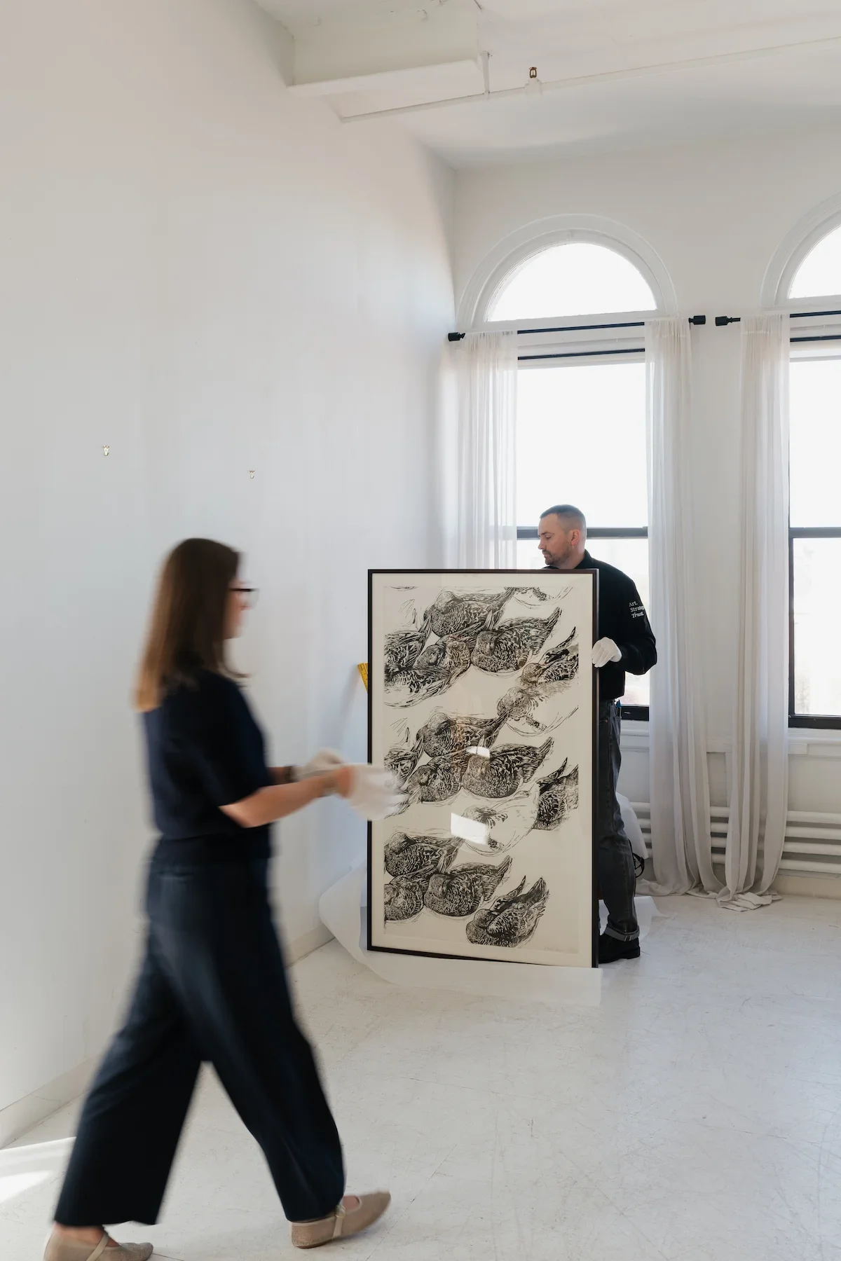Professional installation of artwork in a residential interior