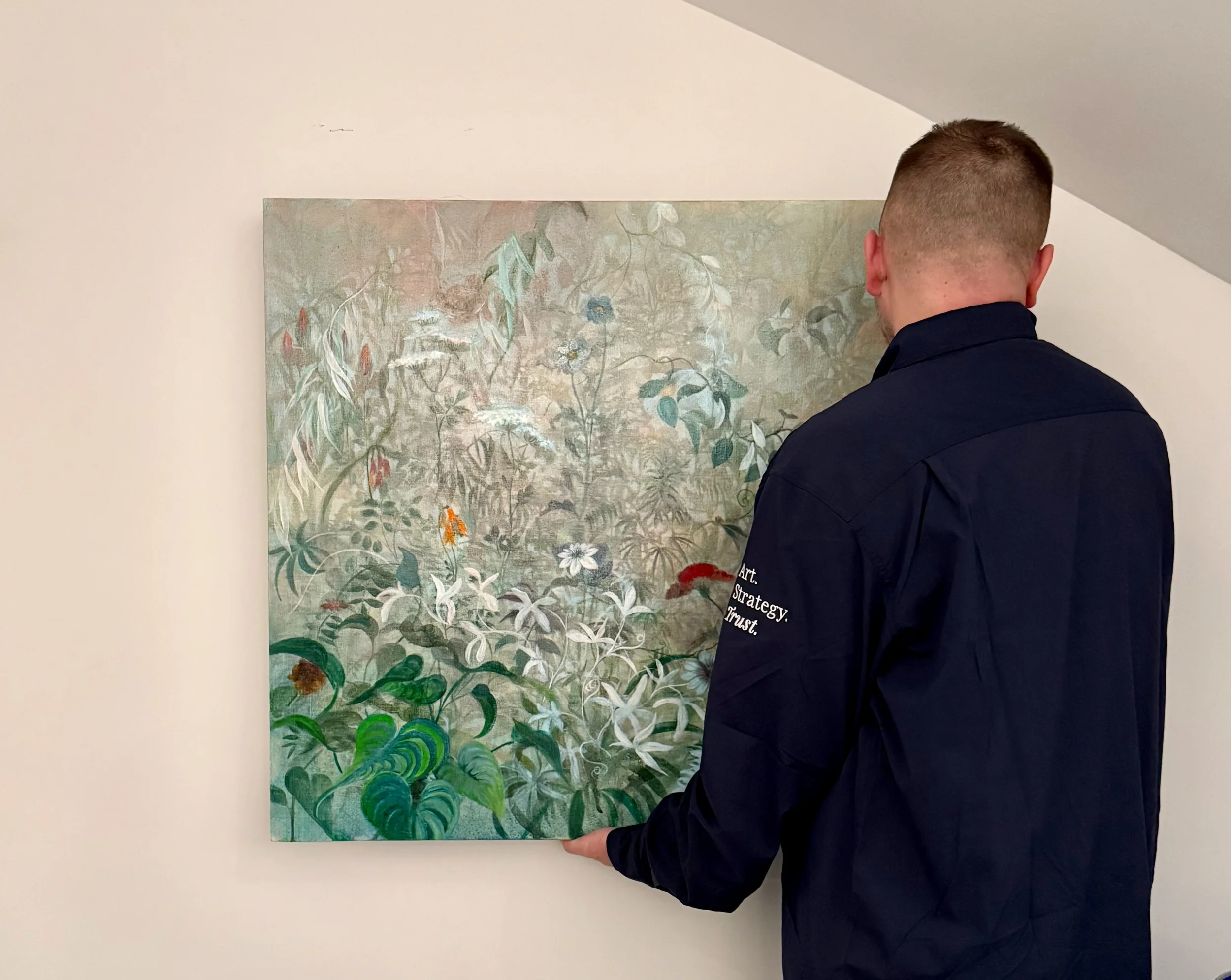 Nicole Chesney painting being installed in a residential interior.