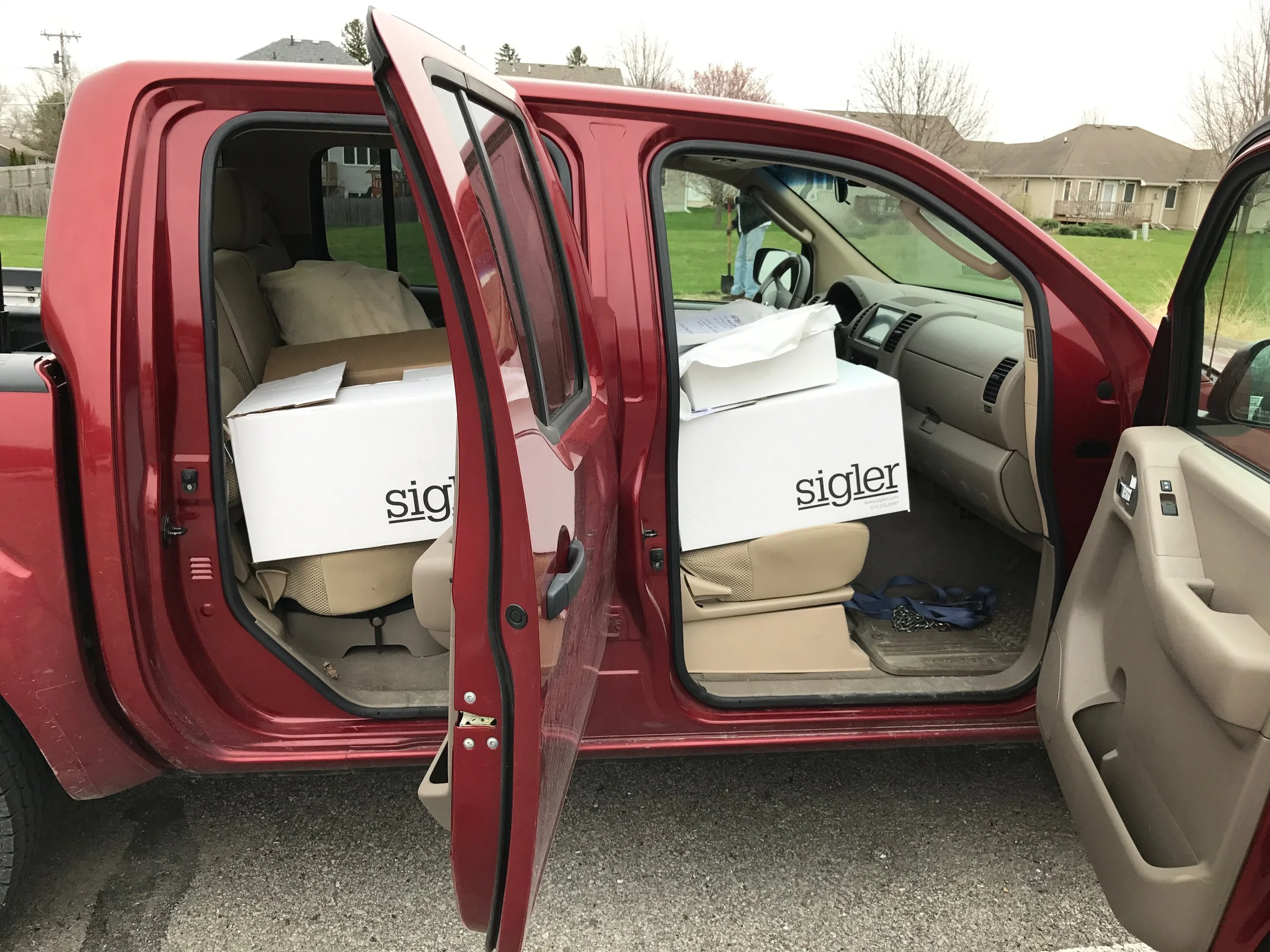 The "rolling dugout," complete with hat boxes, jersey boxes, and two canvas bags full of bats, helmets, and catchers gear. 