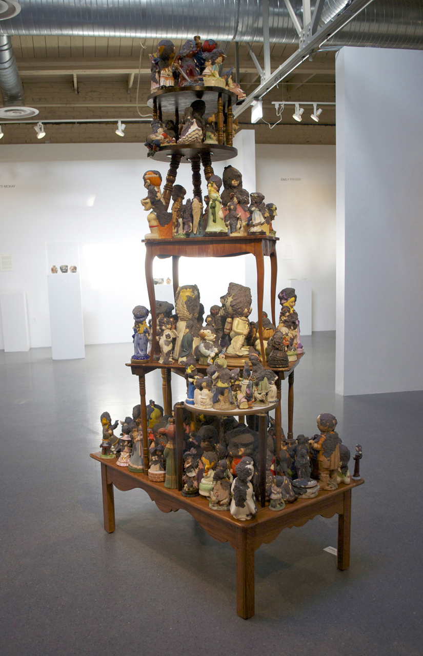   Precious Moments  (Installation View)   2011  Tables, figurines, handmade paper 84" x 36" x 48" 