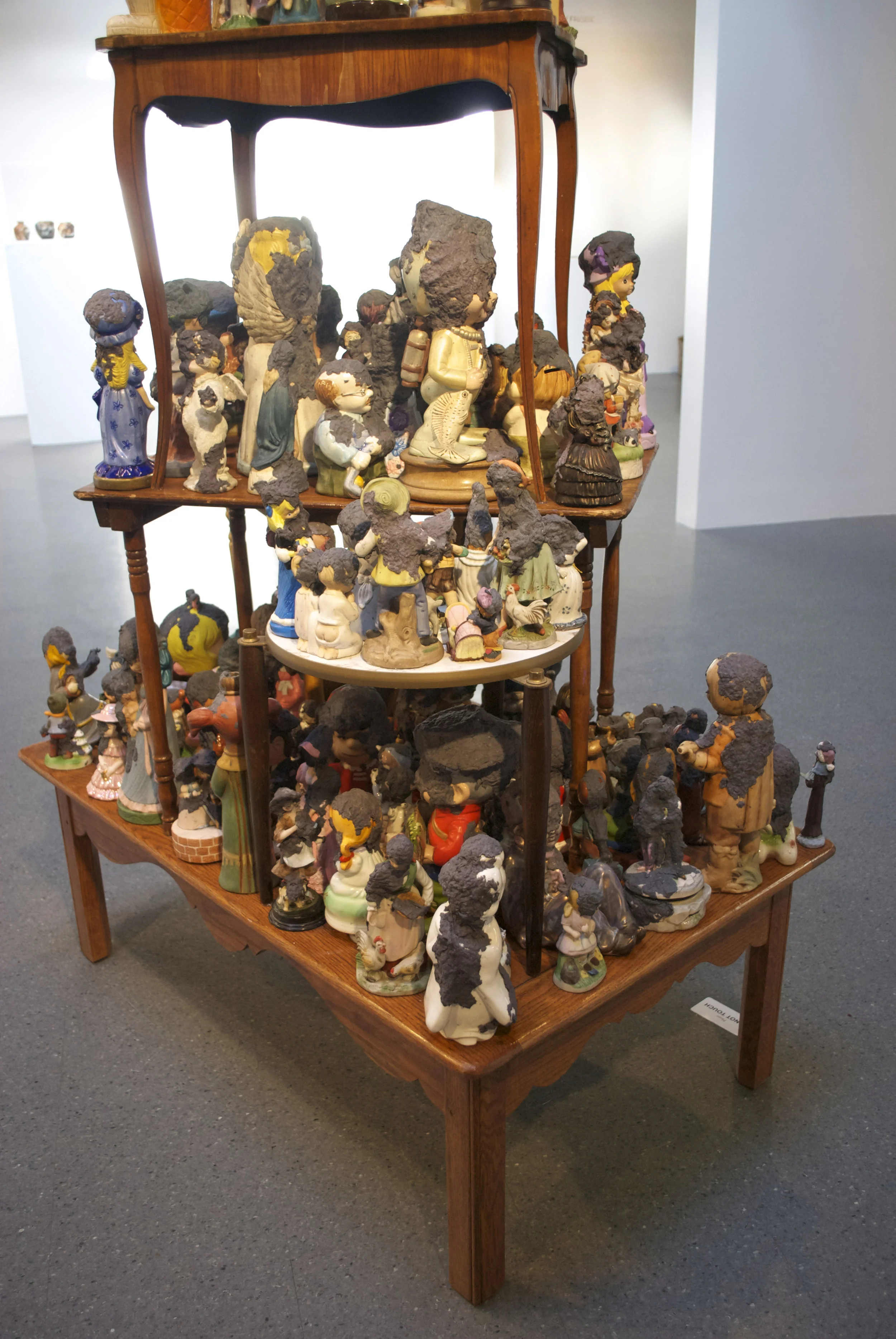 Precious Moments (Installation View) 2011 Tables, figurines, handmade paper 84" x 36" x 48"