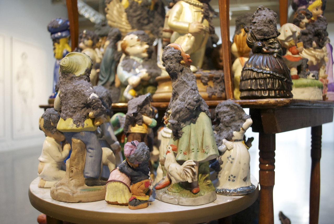 Precious Moments (Detail) 2011 Tables, figurines, handmade paper 84" x 36" x 48"