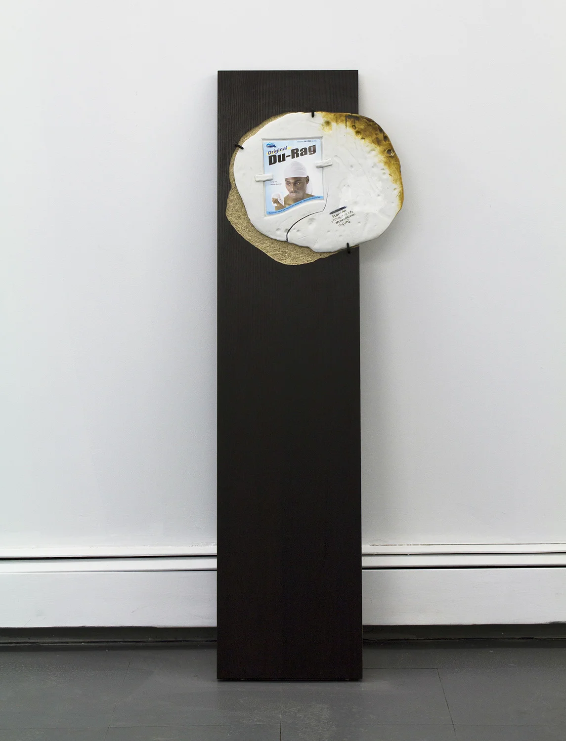 Duplicitous 2016 Composite wood, Porcelain, Epoxy, Advertisement 47" x 16" x 2"