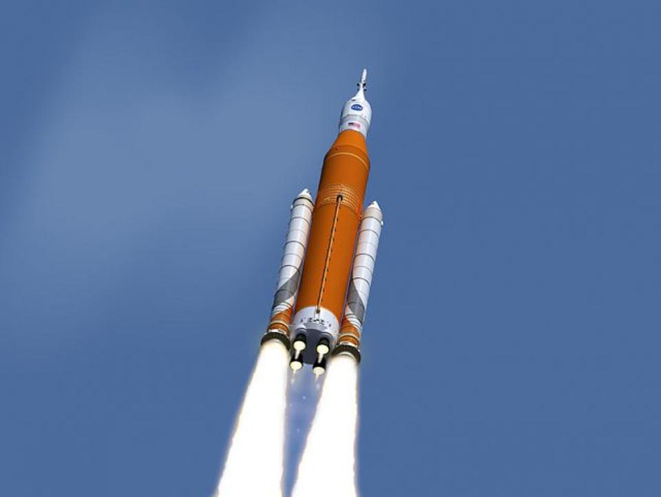 An artist's conception of the Block 1, or baseline, version of the Space Launch System. Solid-fuel rockets are on each side, liquid-fuel core at center, and the Orion crew vehicle is at the top. (NASA/MSFC/Wikimedia)