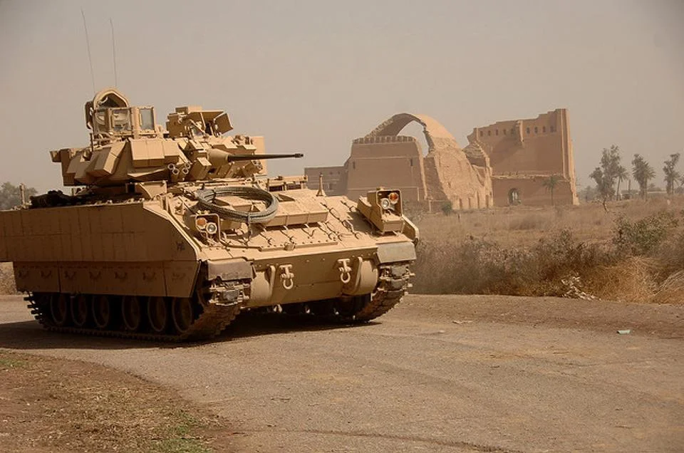 A Bradley fighting vehicle in Iraq during the closing days of the U.S. military occupation. The Bradley is being upgraded and modified to provide the Army with better armored protection, mobility and firepower, but the pace of improvement is hampered by scarce funding. (U.S. Army photo by Sgt. Timothy Kingston) (www.army.mil)