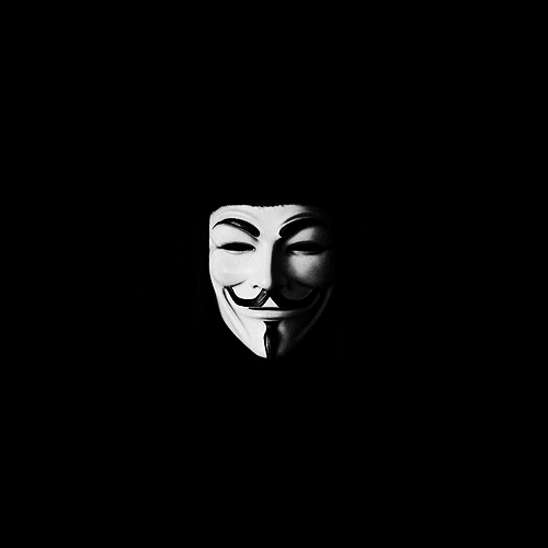 The Guy Fawkes mask from V for Vendetta hanging ominously in a black void.
