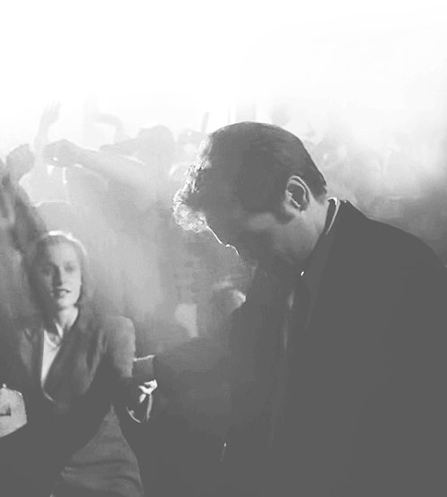 An animated gif of Mulder pulling Scully towards him to dance, from the X-files episode “The Post-Modern Prometheus.”