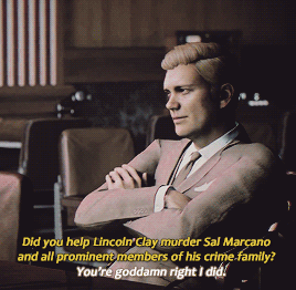 An animated gif of a character from Mafia 3 , a white man in a business suit with his arms insolently crossed. The caption is: “Did you help Lincoln Clay murder Sal Marcano and all prominent members of his crime family?” “You’re goddamn right I did.”