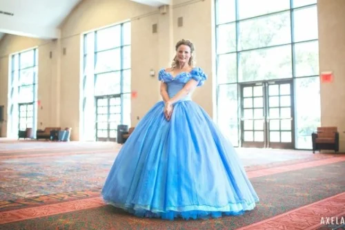 Teresa dressed in the pale-blue ball gown from the recent live-action Cinderella movie, posing in a convention hallway.