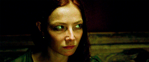 An animated gif of Anne Bonny, from Black Sails , staring intensely at something off-screen.