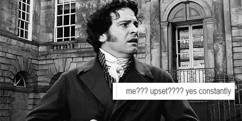 An animated gif of Colin Firth as Darcy, with the caption “me??? upset???? yes constantly”