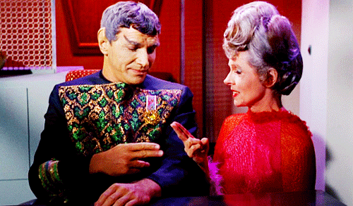 A gif in which Sarek and Amanda, from Star Trek , share a Vulcan finger kiss.