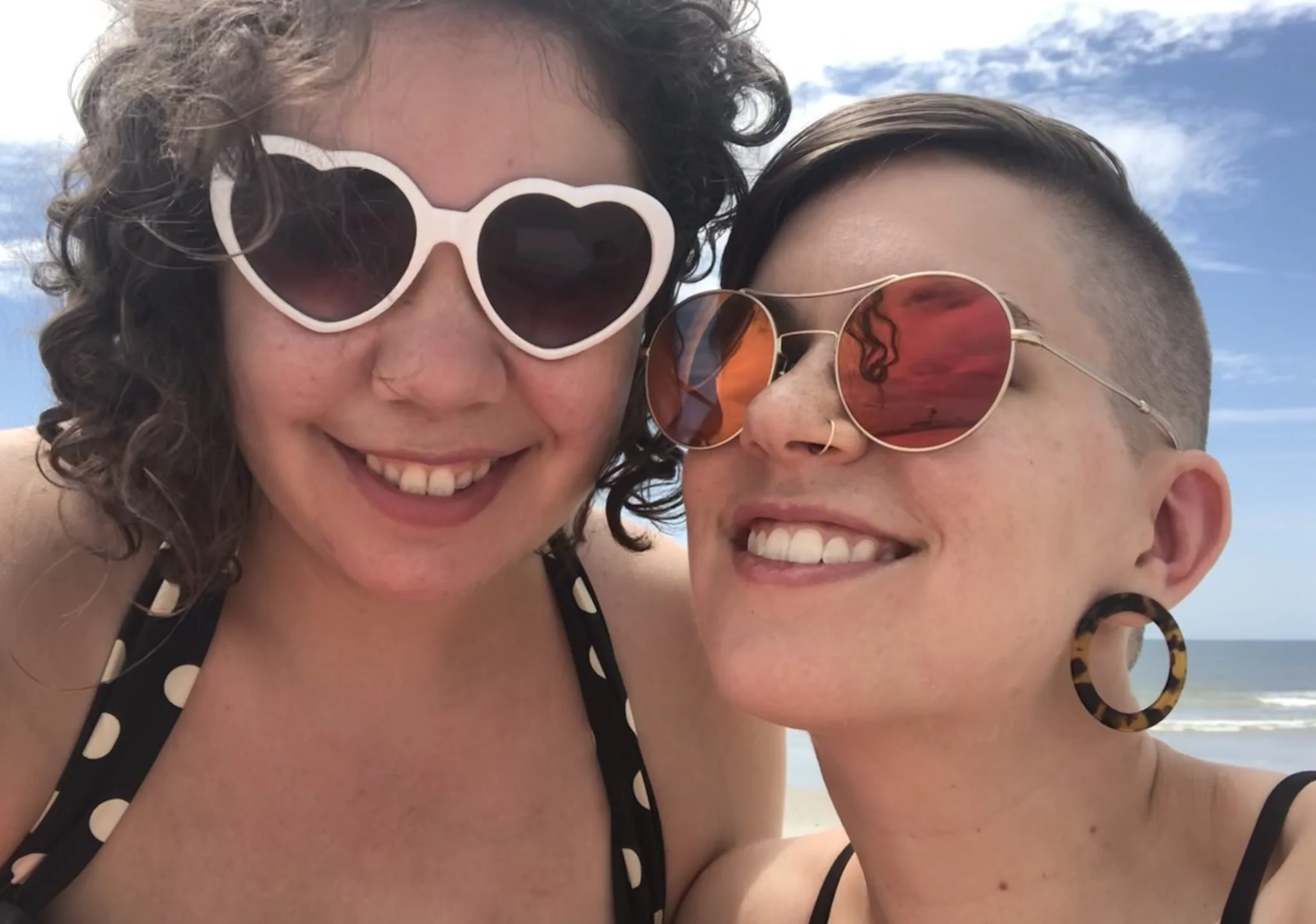 Elizabeth and Flourish, wearing sunglasses at THE BEACH.