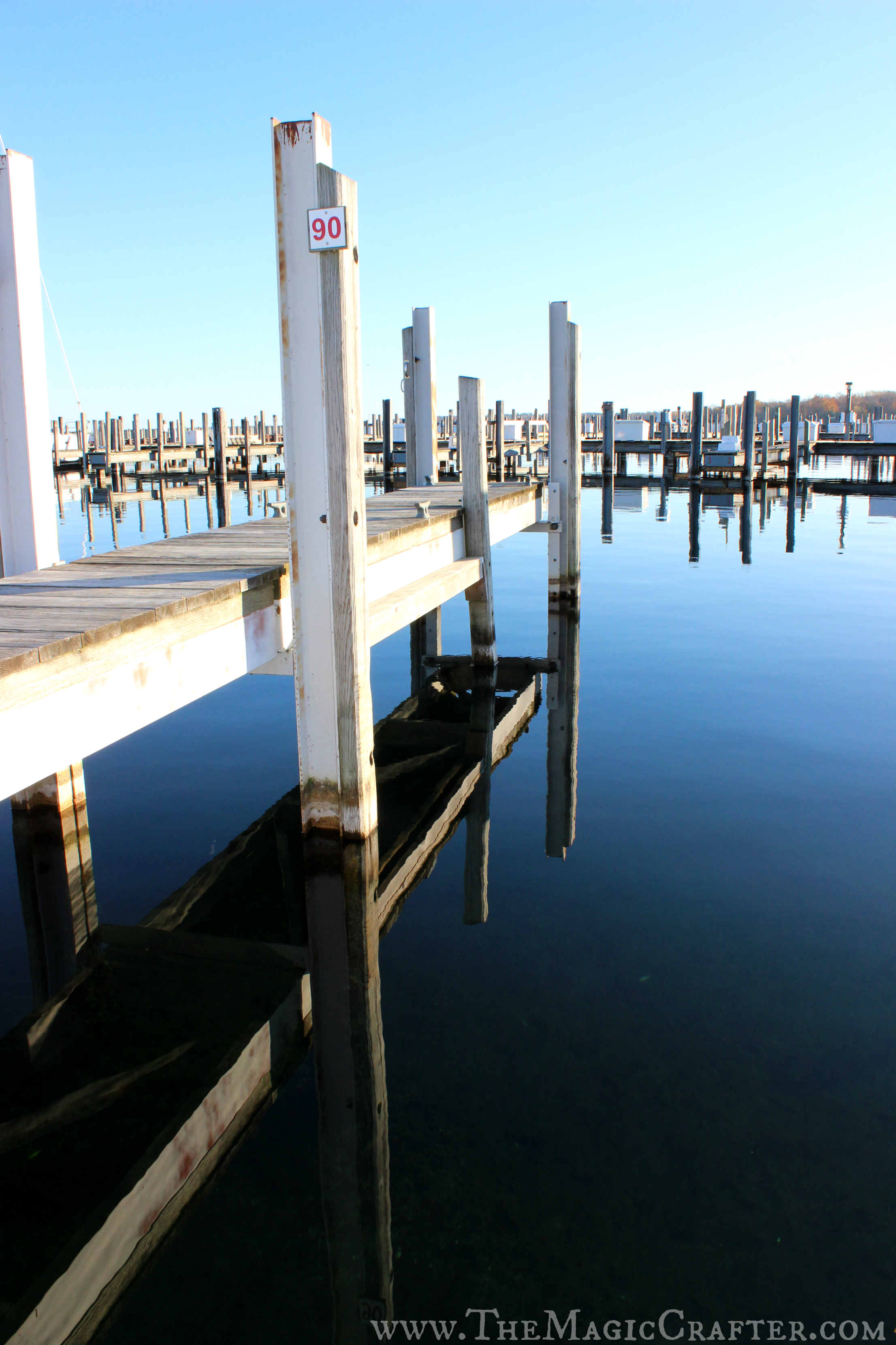 The water on the left side of the marina was much calmer than in the other areas of the marina. This reflection is almost a perfect duplicate of the dock it imitates.