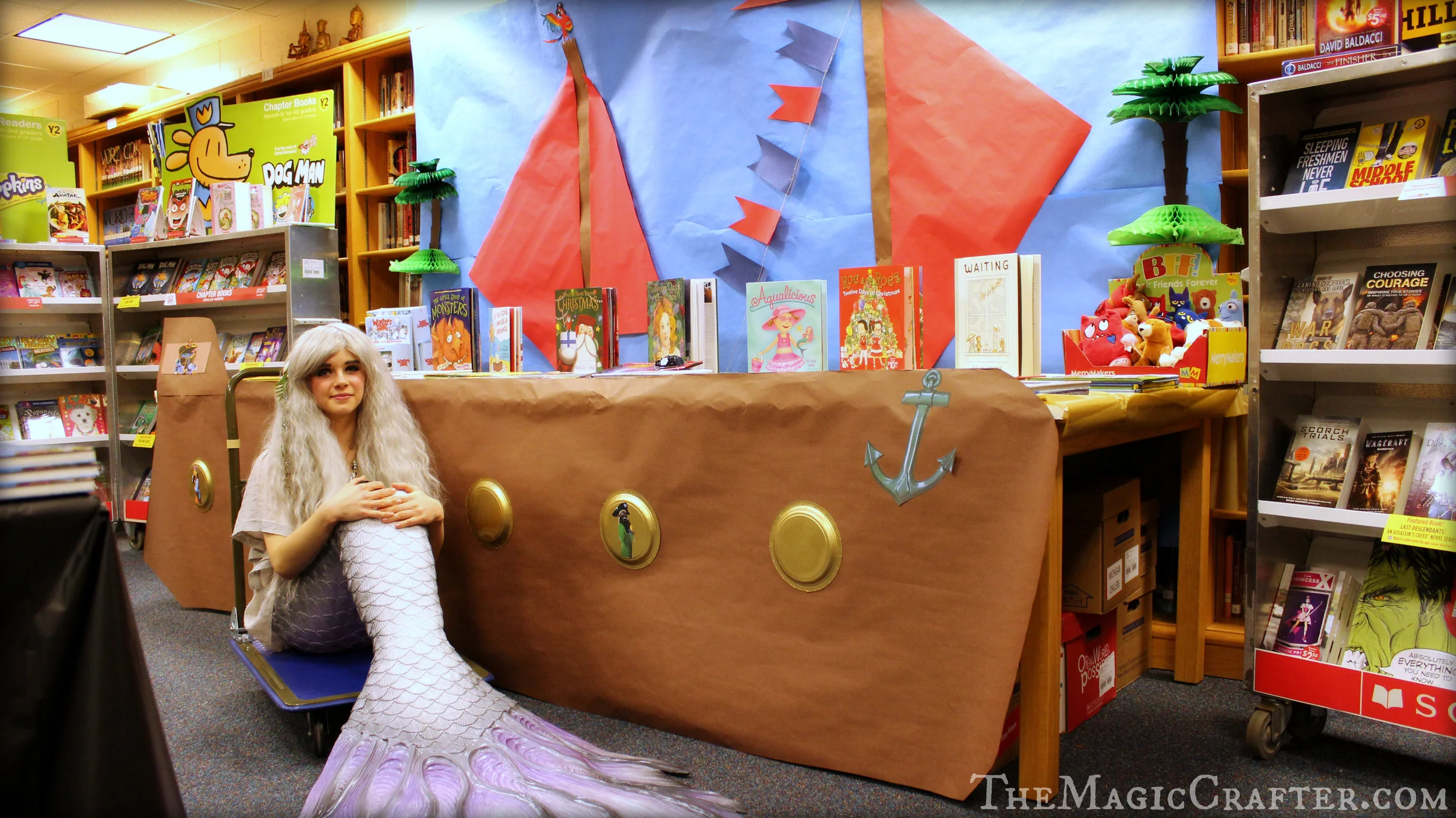 Yesterday (November 29th of 2016) I was a mermaid at the book fair of Northport Public School from 6:00 PM- 8:00 PM. The theme of the event was pirates, so I felt right at home around the ship that was anchored in the library of the school. It looked really neat and made for a lovely perch for some of the books to sit on. However, the pirates were nowhere to be seen... 