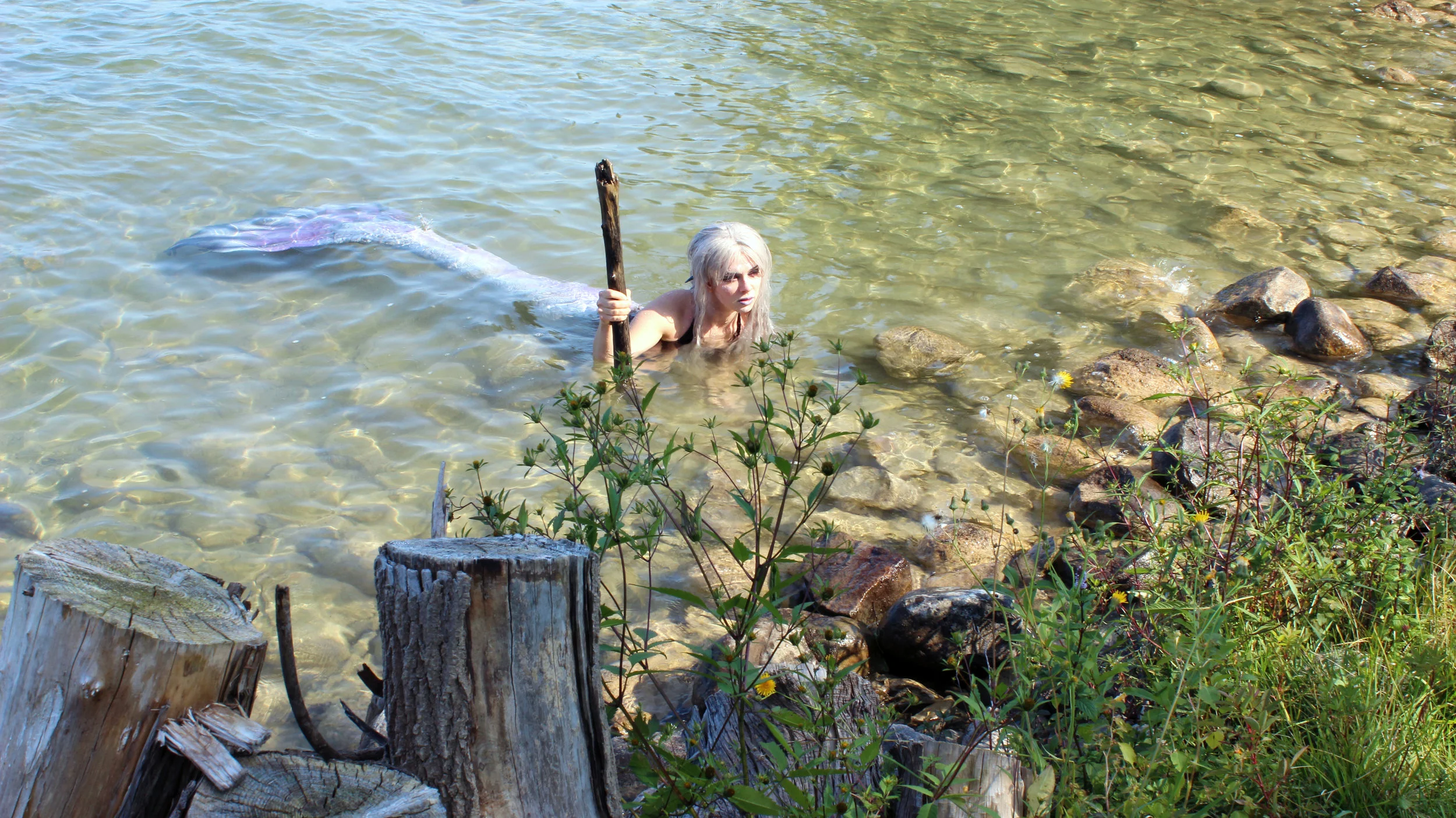 A mermaid and her "trident." Okay... so maybe it's a stick!