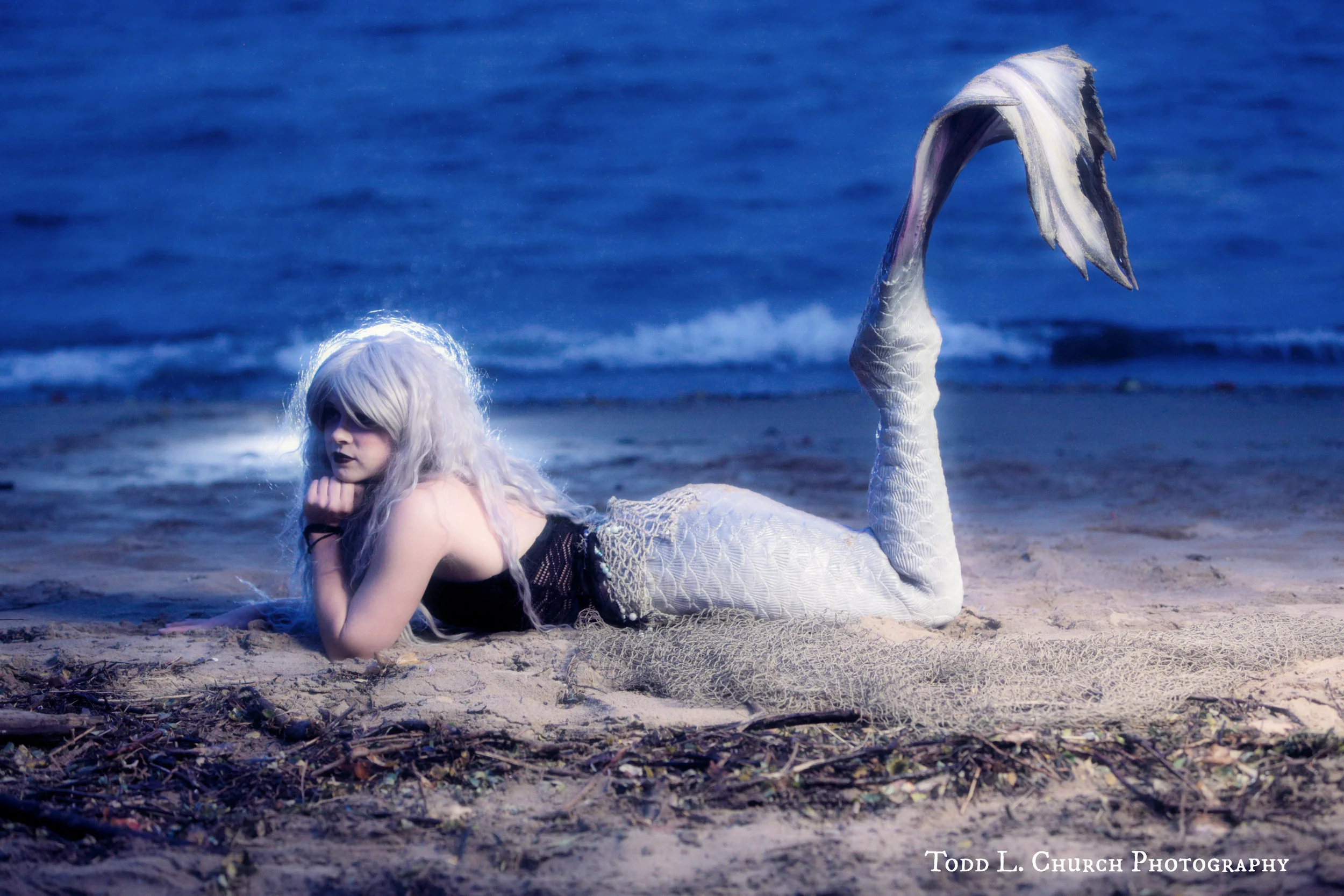 Mermaids in the Moonlight: Mermaid Phantom is a Professional Mermaid from Traverse City, Michigan. Her ghostly tail and her ghostly mane give her her namesake. Mermaid Phantom can most be seen in the summer, although she can be spotted on the beach on certain rainy nights throughout the year! Photo by: Todd L. Church Photography, Model: Mermaid Phantom of www.themagiccrafter.com