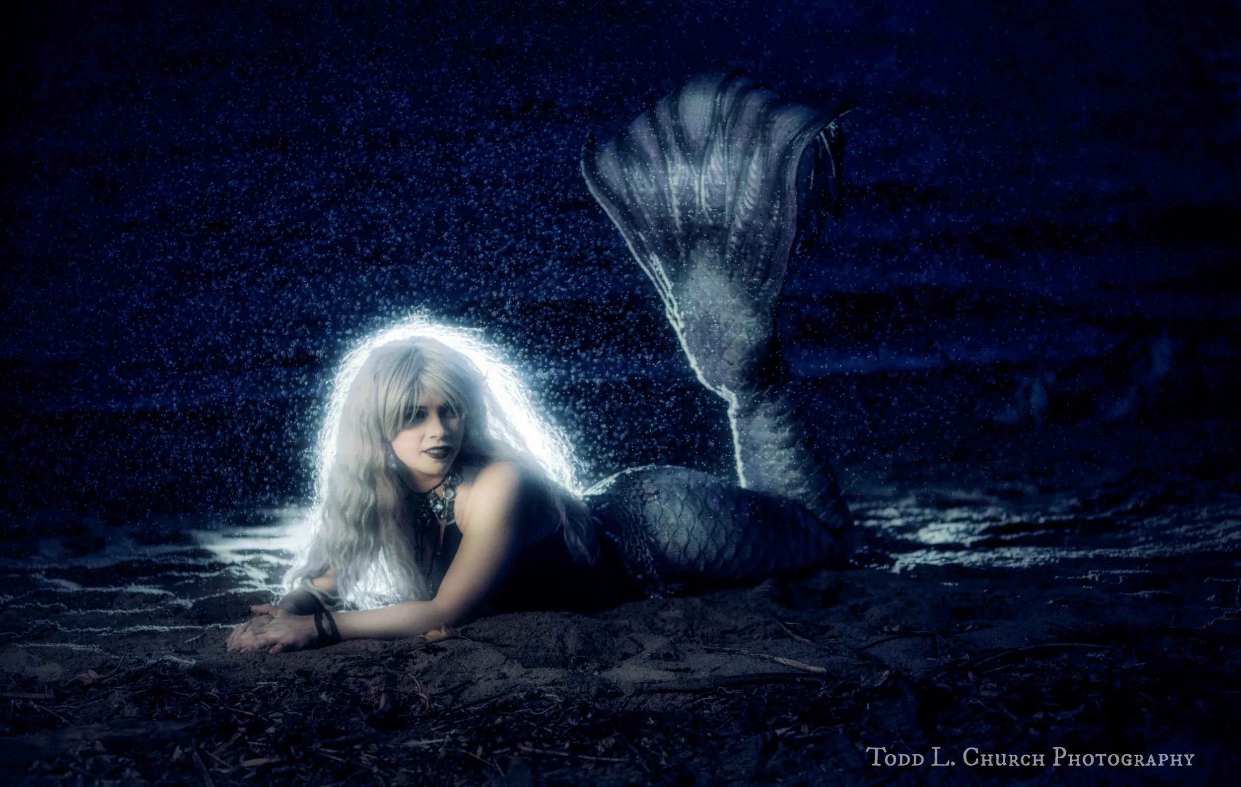 Here is another picture of Mermaid Phantom, a Professional Mermaid, bathing in the rain. This photo turned out a bit darker than the rest, but it looks quite nice and eerie! ;P Photo by: Todd L. Church Photography, Model: Mermaid Phantom of www.themagiccrafter.com