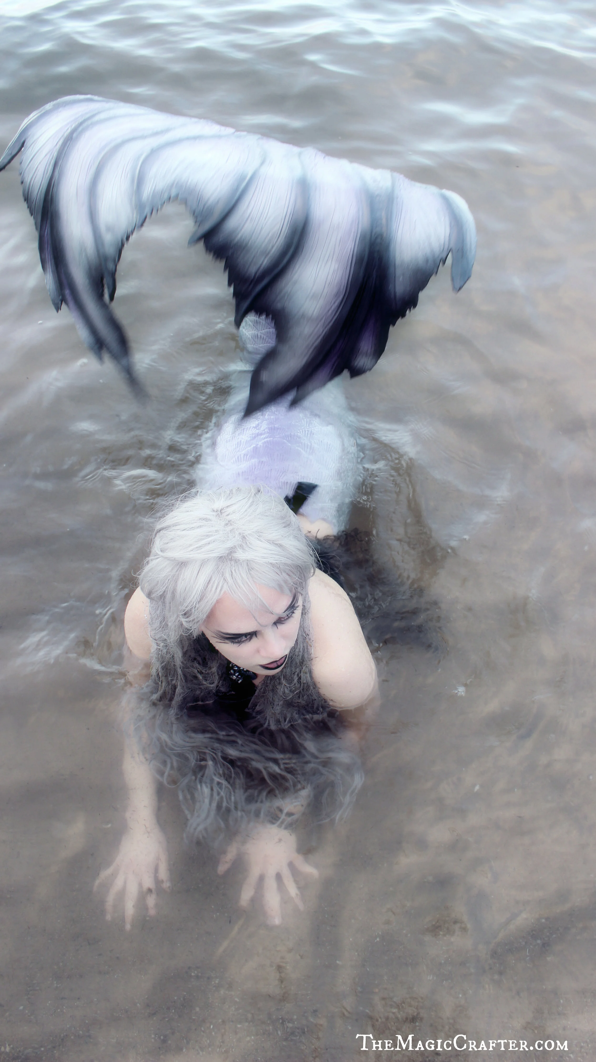 Mermaid Images: Pictures of a creepy Goth mermaid in the water. This is Mermaid Phantom, one of Michigan's only real live mermaids. She is a professional mermaid who lives and works in the Traverse City area. Despite her odd looks, she is actually quite great with children and does not usually dress so scary. :)