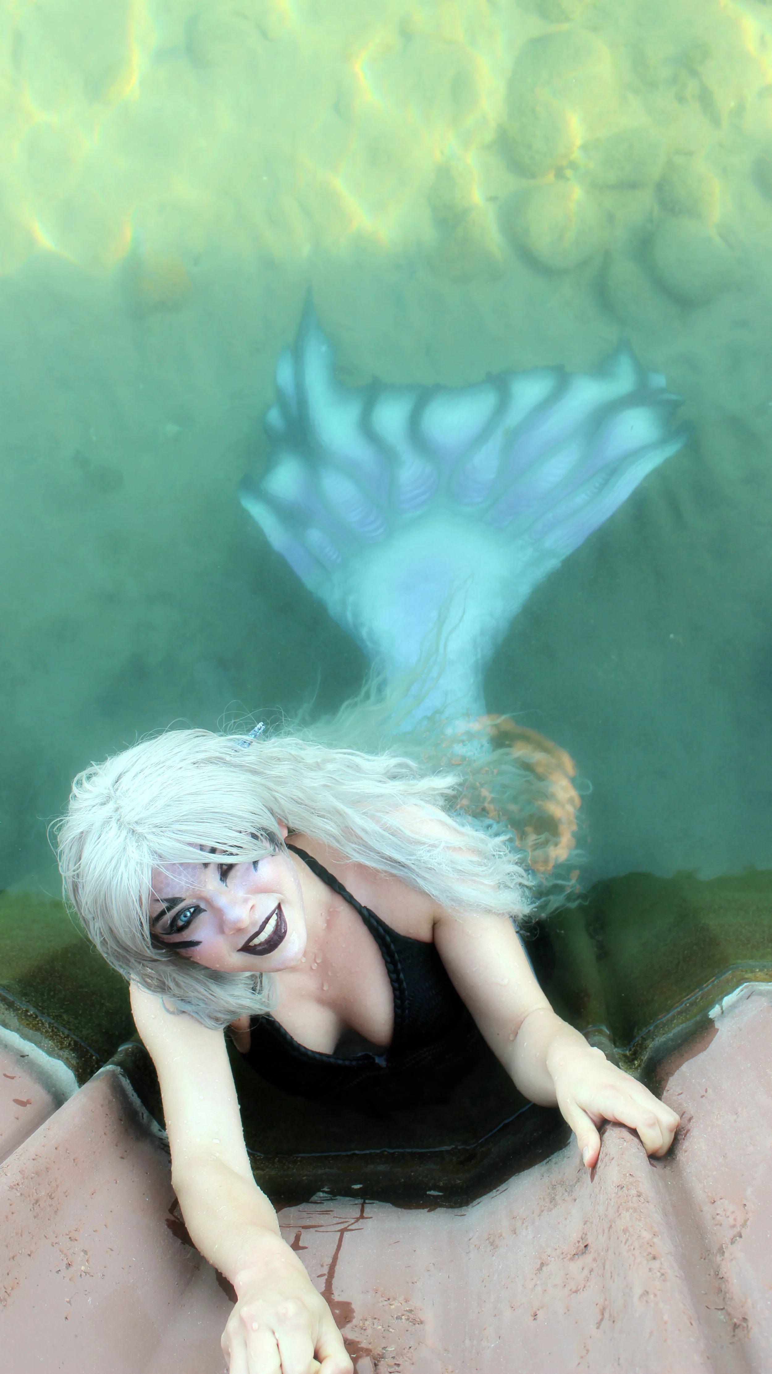 Siren Pictures- Mermaid Phantom was swimming in Northport for a filming session when someone snapped a picture of her (okay, maybe she was posing for a picture). On this day, she was dressed in a way that would make you think of her as one of the sirens, not a classic mermaid princess! She's been a Gothic Girl as long as she can recall though, so her sirenesque look really isn't much of a surprise to those that know her well. #sirens