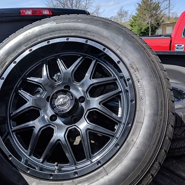 Wheel Wednesday! One of our favorite colors, Lazer black, on a set of truck tires with contrasting gloss black painted center caps.  Don't forget we can now dismount, mount, and balance wheels in house. #lazerblack #truckwheels #americanracing