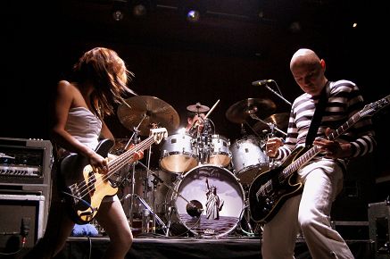 Performing with the Smashing Pumpkins.