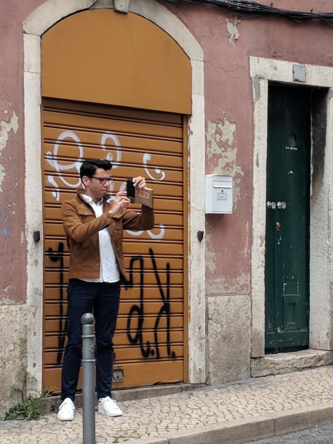 Designer taking photos of Lisbon Azulejo Buildings