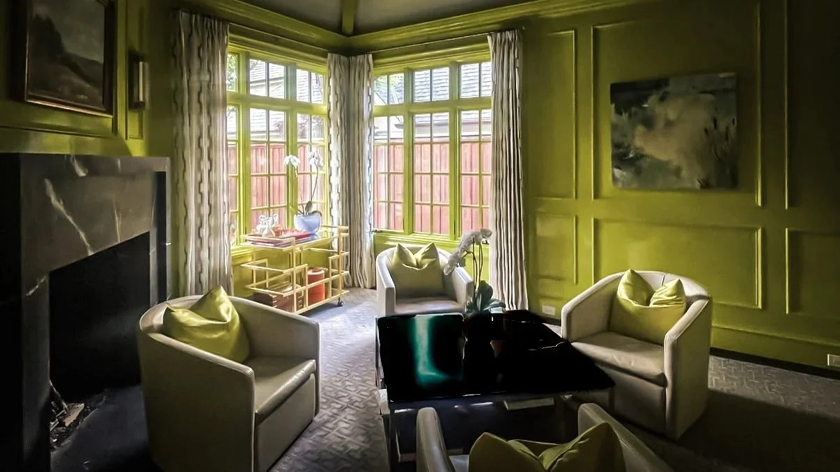 Chartreuse sitting room with marble fireplace, bay windows, and custom paneling by Kara Legako Design, Dallas TX