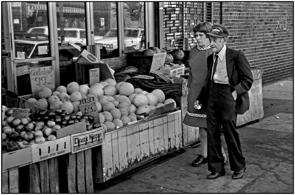 Korean War veteran, his partner, and cantaloupes at 99 cents each, New Jersey plum tomatoes at 59 cents/pound, water melon at 35 cents/pound, near Brighton Beach Avenue