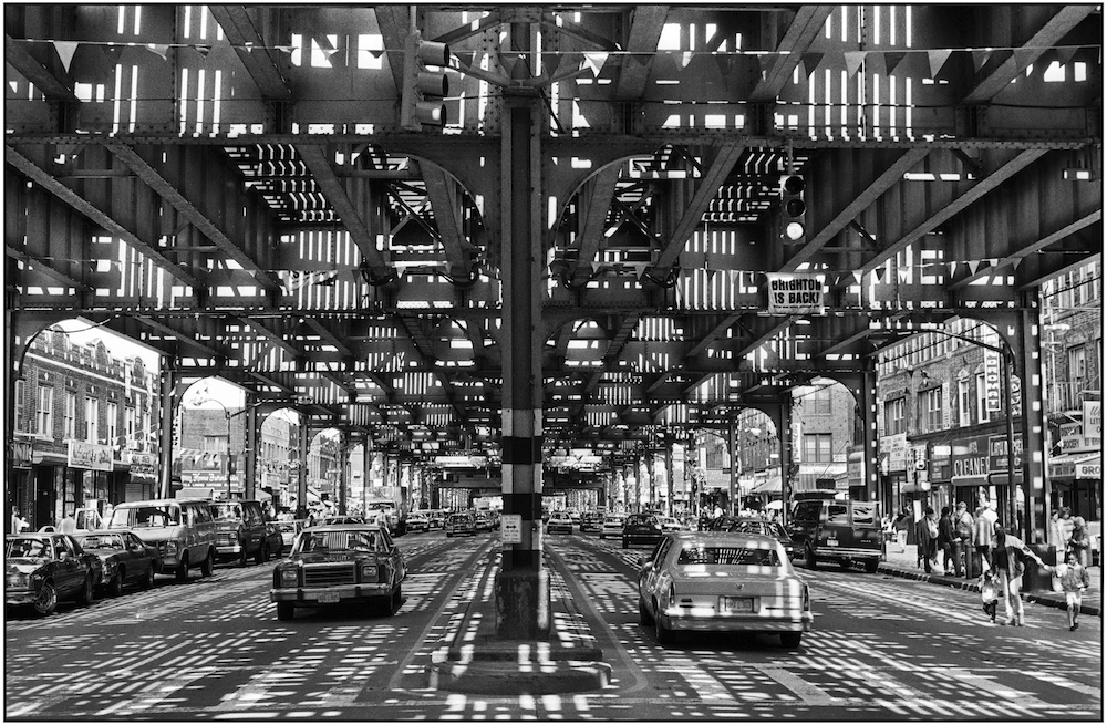 Brighton Beach Avenue, the main shopping/commercial street in Brighton Beach. Overhead is the steel structure and MTA train tracks, more commonly known as the elevated subway. May 9, 1990
