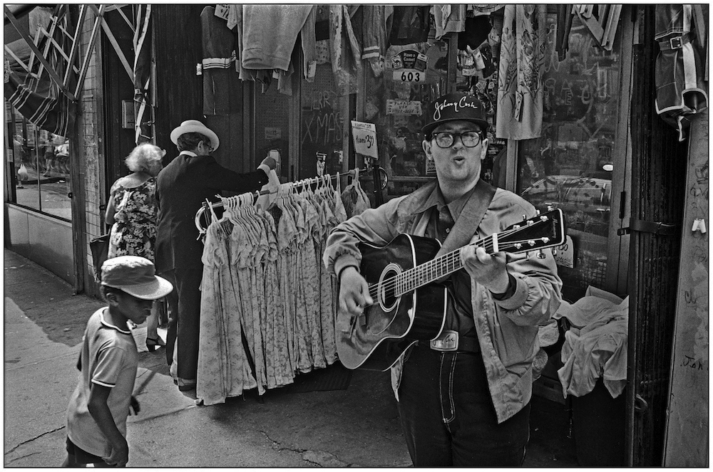 A fan of popular musician, Johnny Cash, with his signatures on hat and belt buckle. Dresses for $3.50. July 5, 1986.