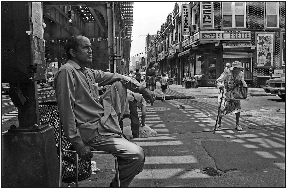 A merchant on Brighton Beach Avenue during a holiday, shopping lull. May 31, 1986