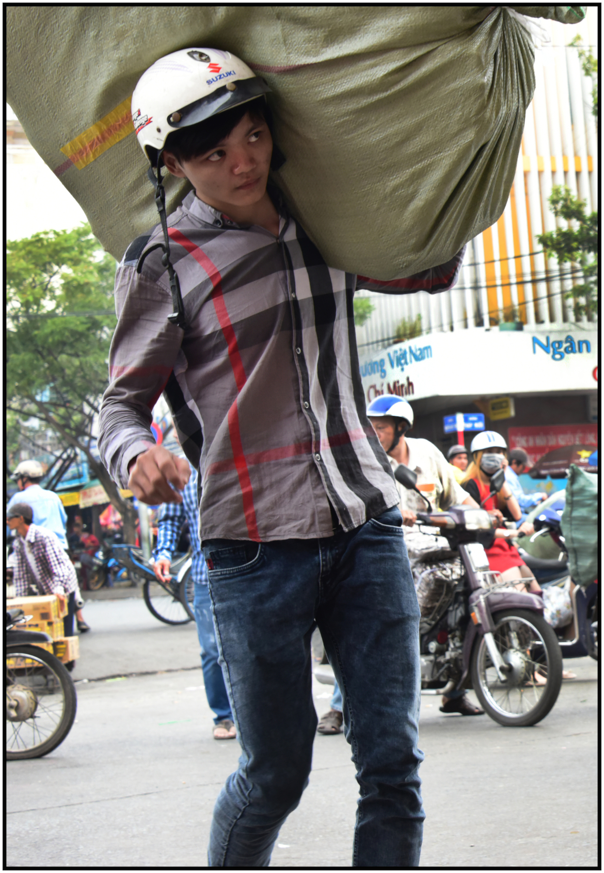  Worker carries merchandise from truck to Binh Tay Market, Cholon, Saigon/HCMC, Dec. 2015. #4147 
