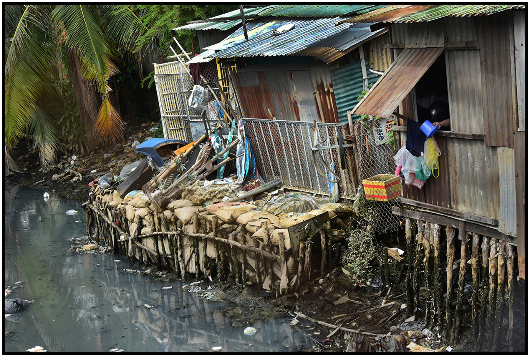  Housing for the poor on polluted canal, Saigo/HCMC, Dec. 2015. #4879 
