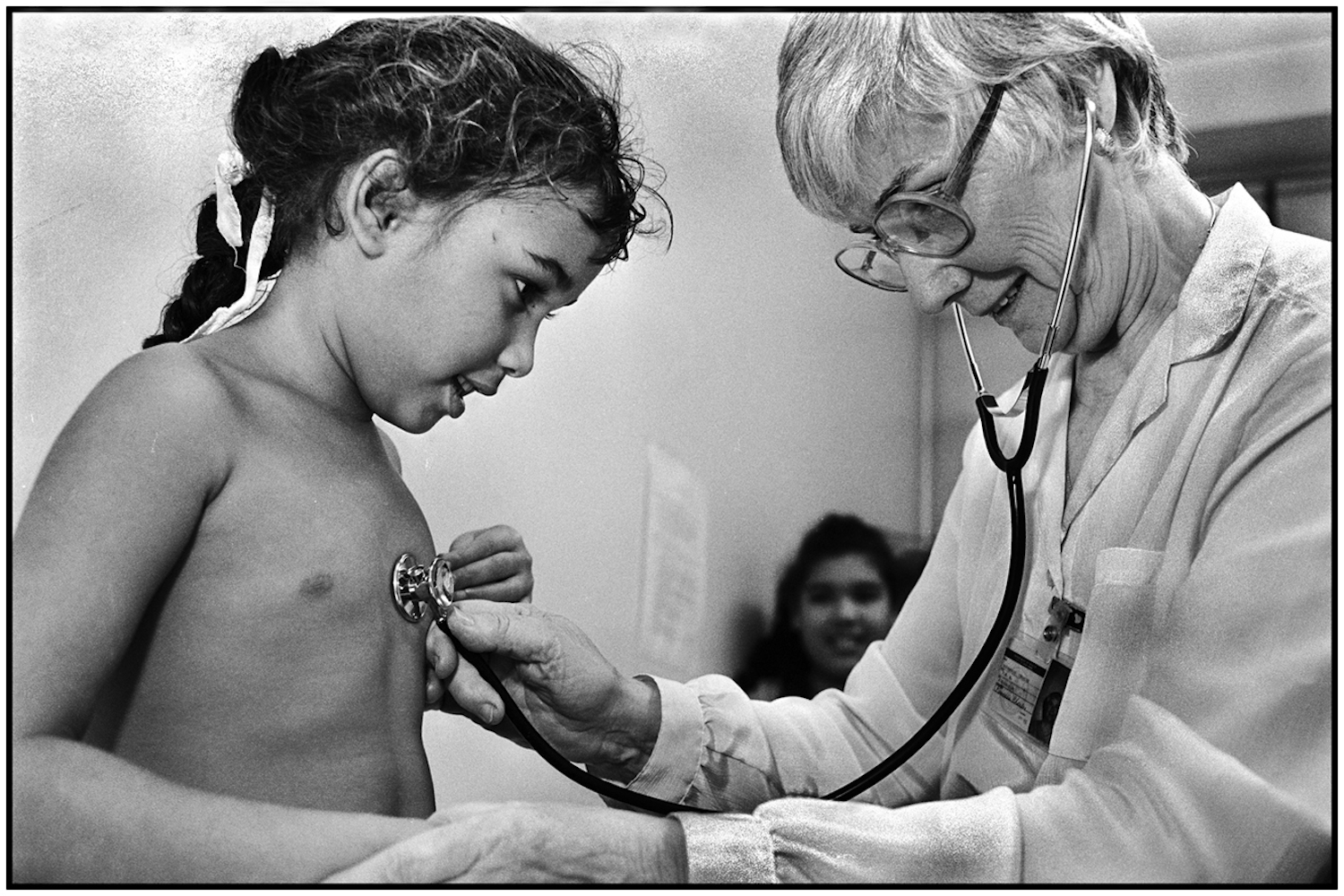 Public Health Nurse, Rosemary Charles and a patient at the Jamaica S chool Health Clinic, Queens. 1991.