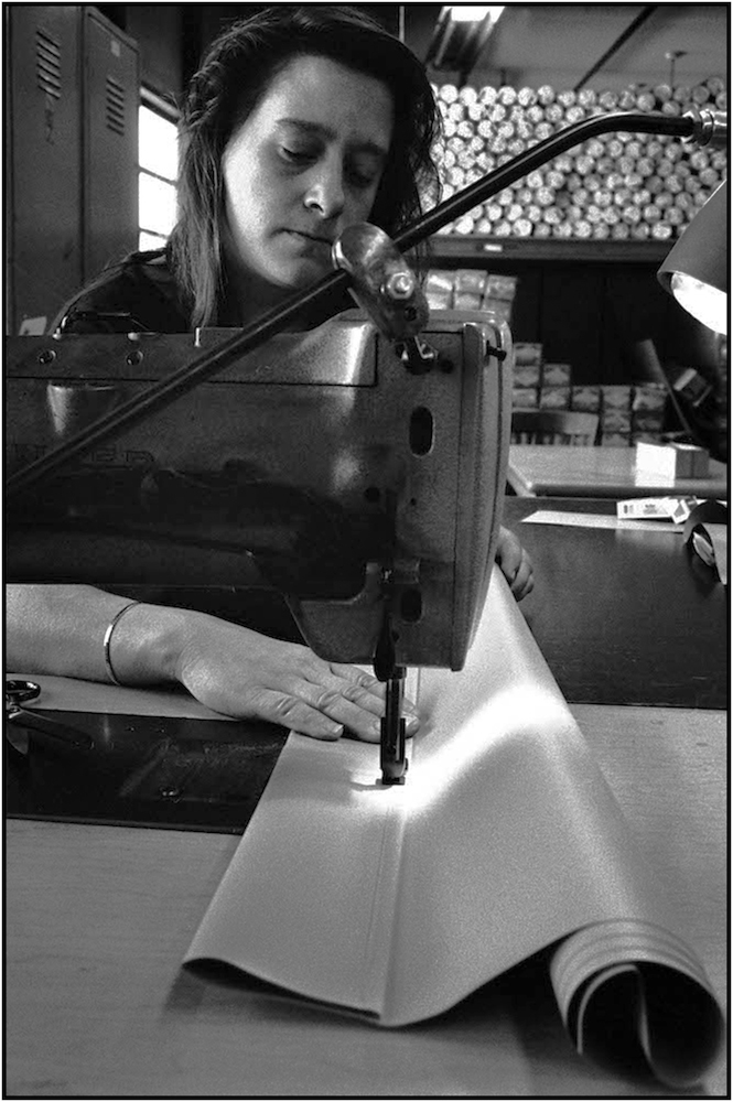 Worker manufactures school window shades . 19--.