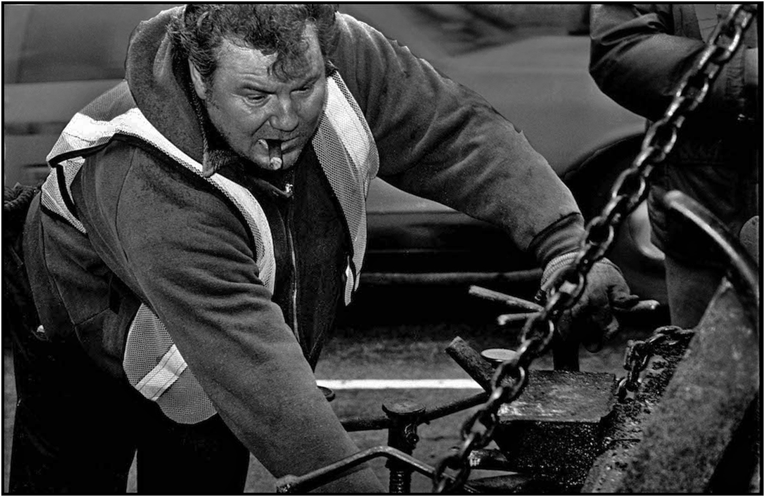 Highway Repairer works on a resurfacing gang on an extensive area of Central Park roadway in Manhattan. 1984.