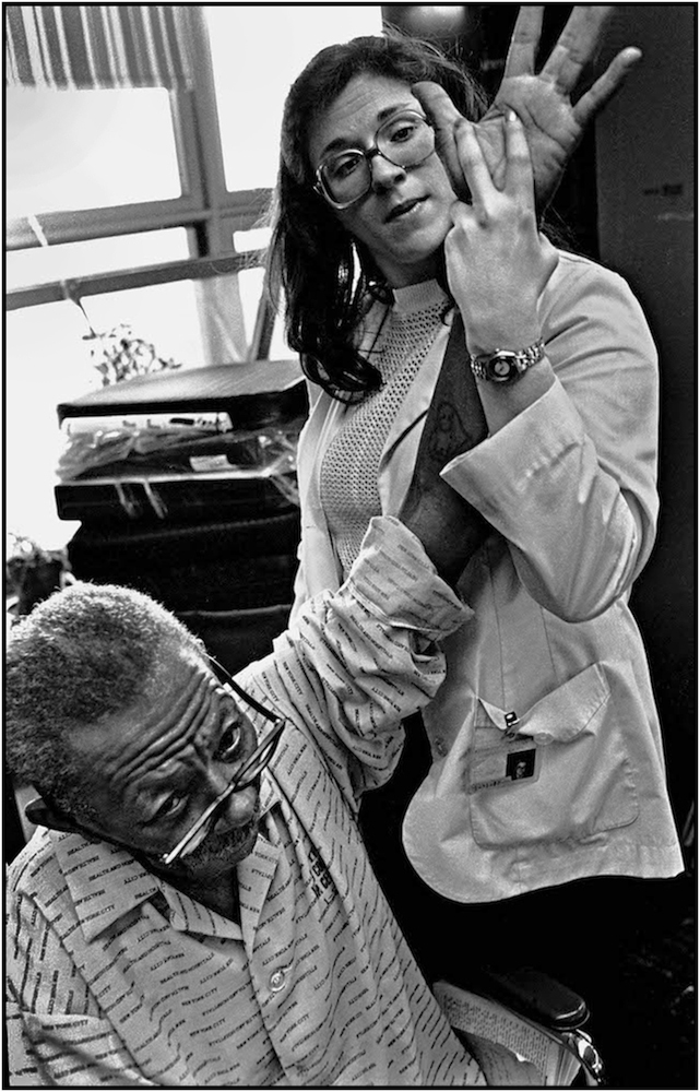 Occupational Therapist works with Maximo Palmer at Bellevue Hospital, Manhattan. 1981.