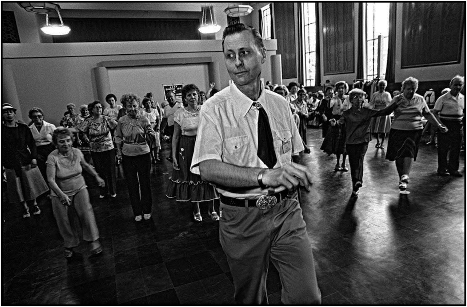   Russell Ericson, a Department of Parks and Recreation  Assistant Recreation Supervisor, &nbsp; leads seniors in dance at the War Memorial Recreation Center in Brooklyn. 1985.  