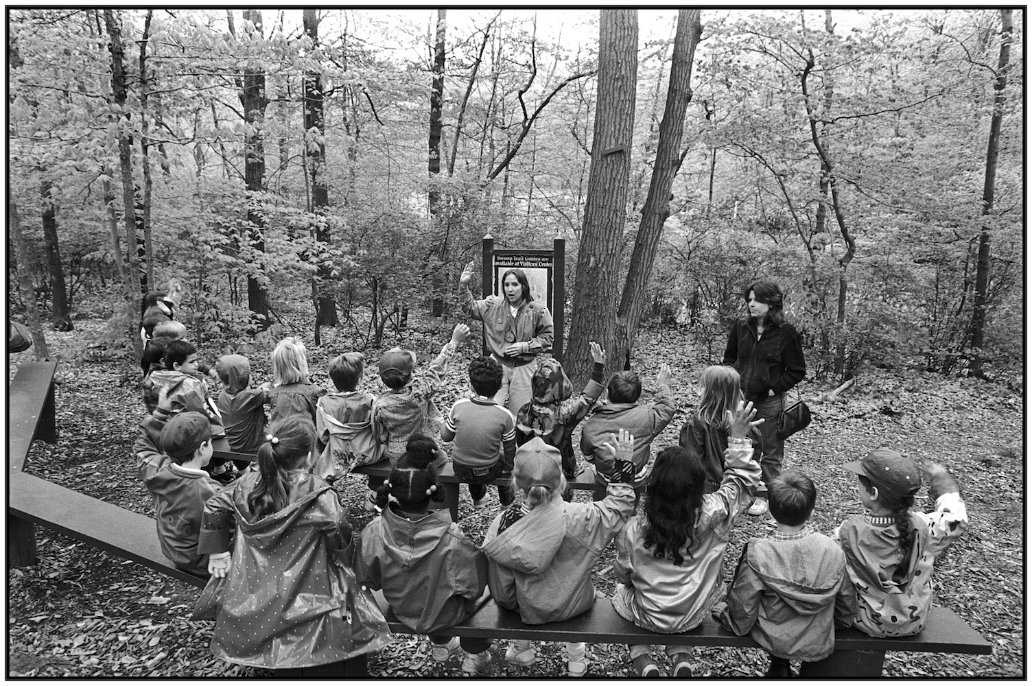   Karen Golop dicusses nature walk with students in Staten Island's High Rock Park. 1988.  