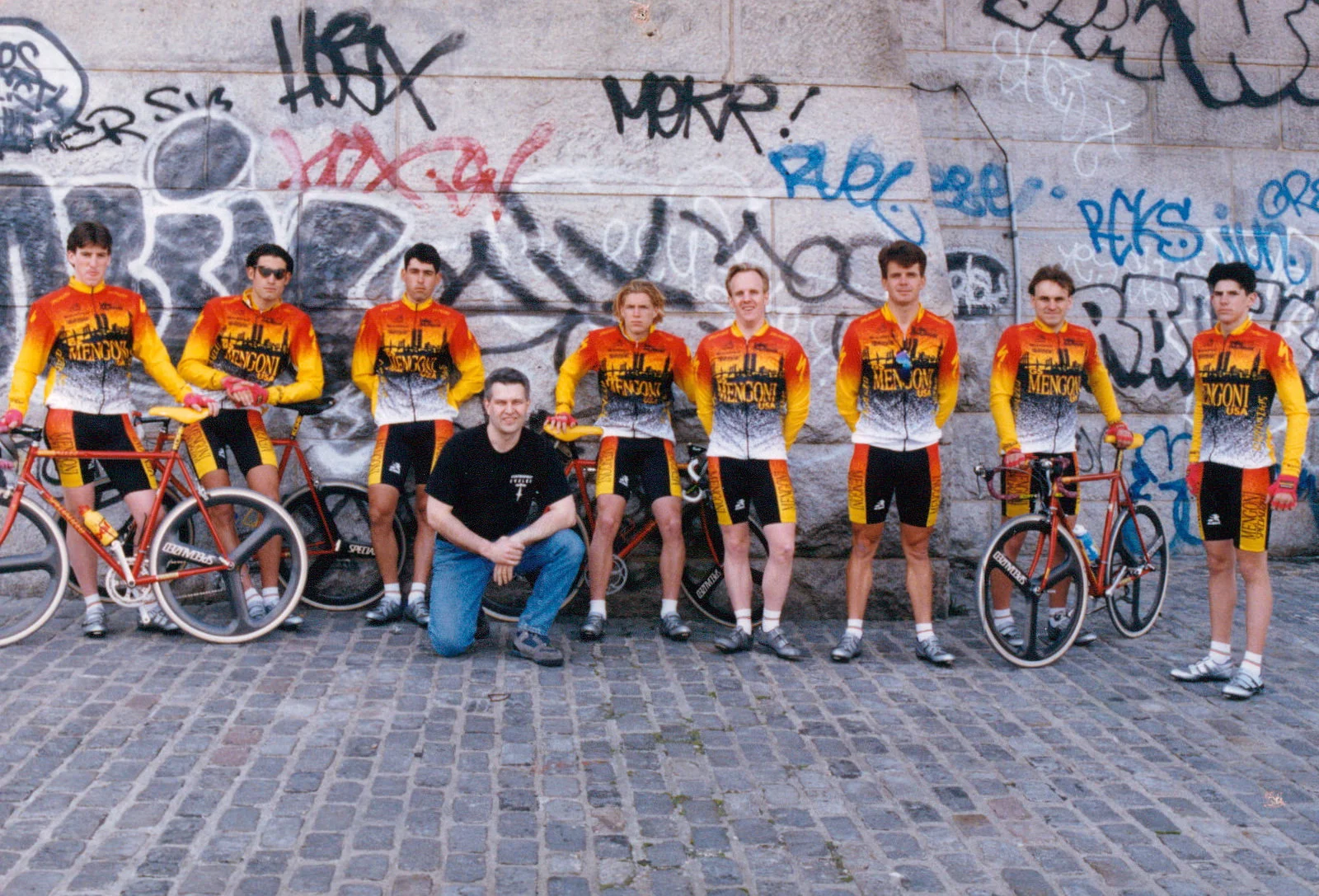 1991: Members of the G.S. Mengoni team. "This was taken around 1991 by John Issendorf. We're standing in front of the Brooklyn Bridge. George and Ricky Hincapie were on the team as well as a few other very good riders. I was the team mechanic. IIRC George turned pro the next year." - Jamie Swan