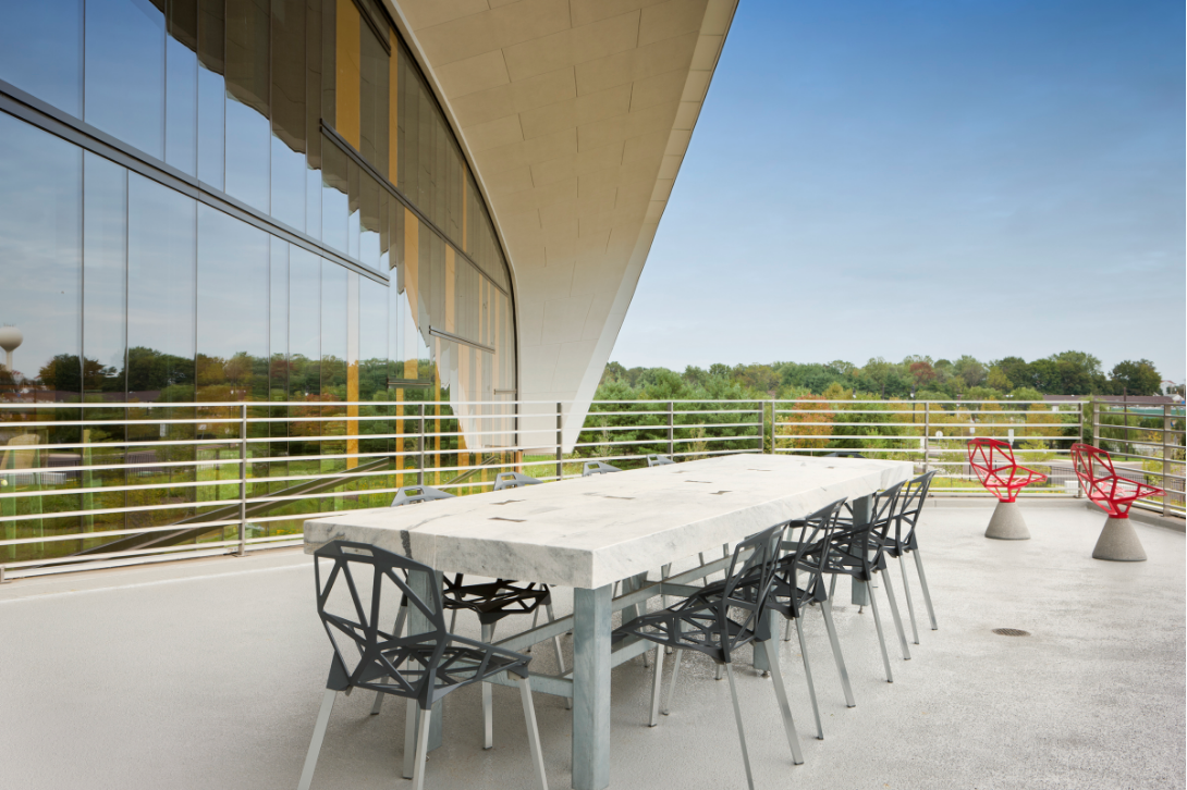  Massive marble outdoor table and galvanized steel base. This one had to be lifted onto the roof-deck with a crane. 