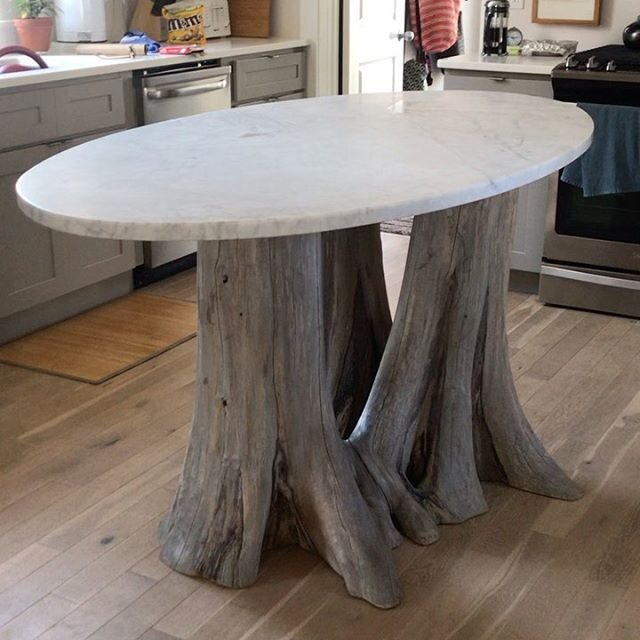 #todaysdelivery  multistem root base #beachhouse  #kitchenisland finished with a weathered grey stain with an oval #honed #carraramarble 5/4&rdquo; thick top .#customfurniture #gratitude