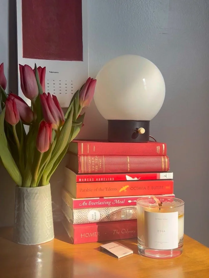 inviting color and warmth wherever and whenever possible on day 34850 of winter. ⁠
⁠
refreshing the home office by coordinating the 2026 @artproblems_studio calendar with a book stack, a fresh bunch of flowers and, of course, a fragrance. a fun exerc